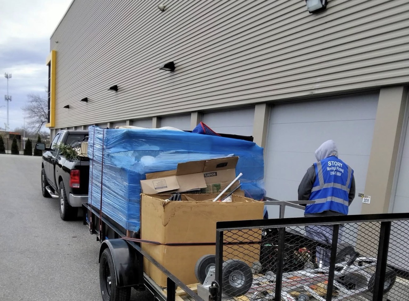 Trailer loaded with wrapped furniture